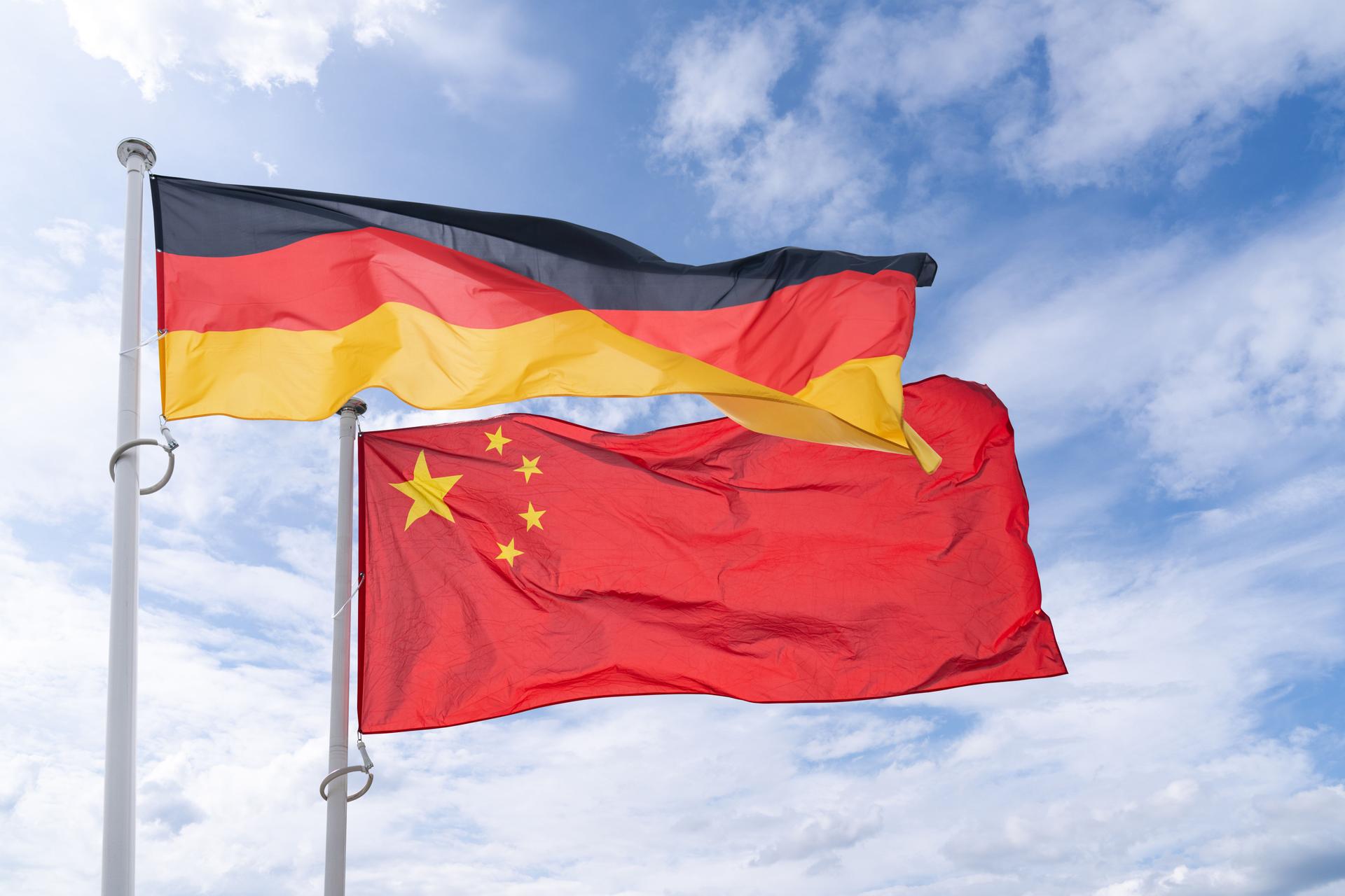 German and Chinese flags flutter in the wind